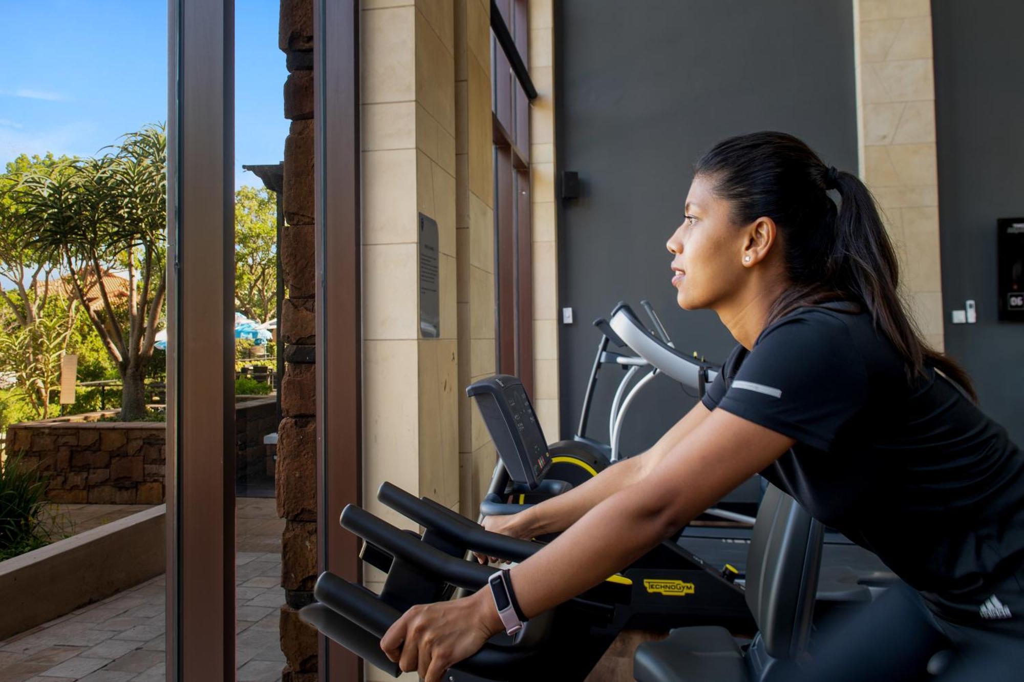 The Capital Zimbali Hotel Ballito Exterior photo A woman on a treadmill